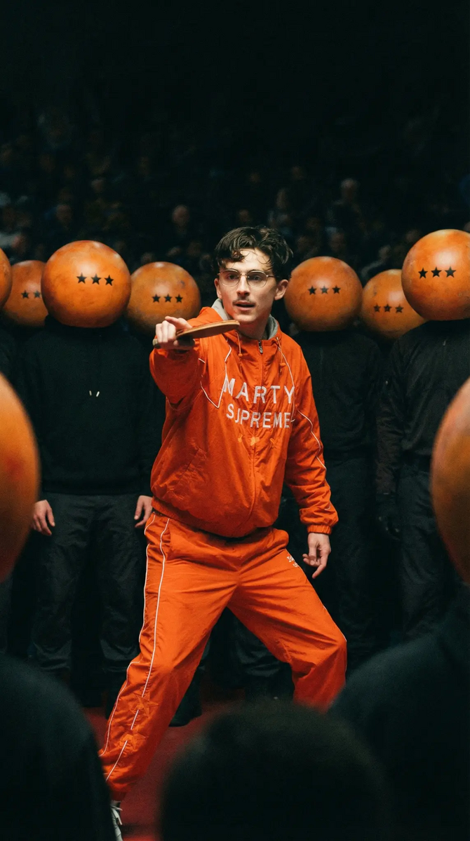 Marty Supreme streetwear campaign featuring orange branded apparel with creative styling
